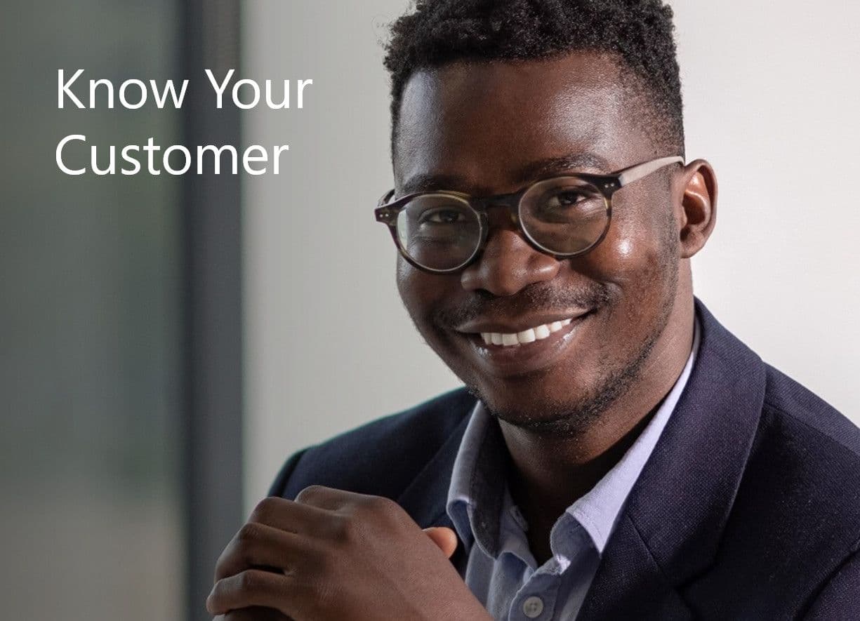 Smiling Black man with glasses and suit jacket, with 'Know Your Customer' text.